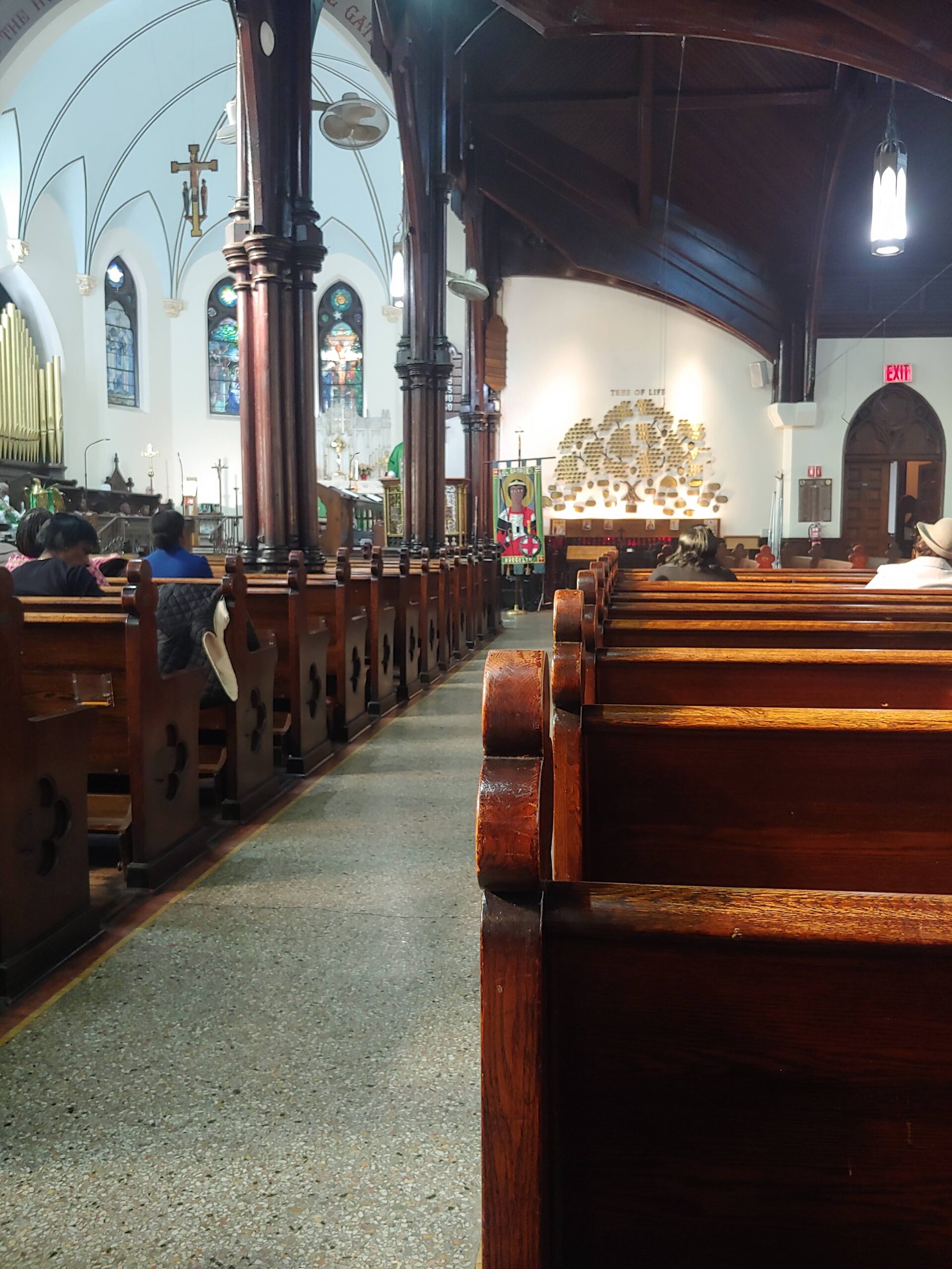 Photograph of the aisle and pews of St. George's Church.